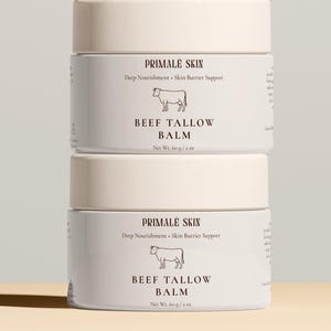 May include: Two stacked white jars of Beef Tallow Balm with beige lids. The labels read "PRIMALE SKIN" and "BEEF TALLOW BALM" with a cow illustration. Each jar contains 60g / 2 oz of product.
