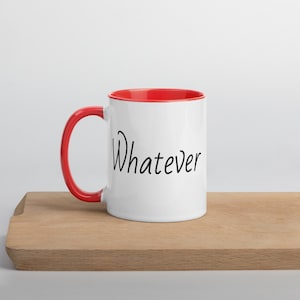 May include: White ceramic mug with a red rim and handle. The mug has the word "Whatever" written in black cursive on the front.