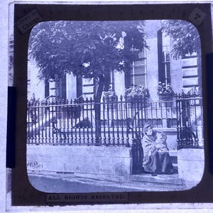 Antique Glass Black and White Magic Lantern Slide, by Early 20th century Slide, Edwardian Woman with her Child on the street