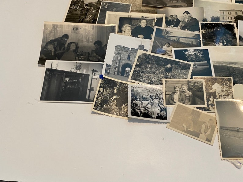 May include: A selection of monochrome vintage photographs, capturing diverse scenes and individuals. The images feature portraits, landscapes, and group photos, providing a nostalgic look at the past. The photographs are displayed on a white surface.
