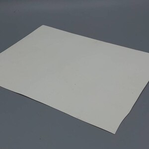 May include: A plain white sheet of paper.