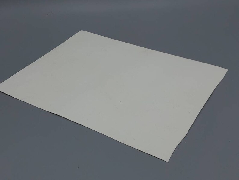 May include: A plain white sheet of paper.