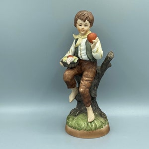 Vintage Bisque Porcelain Figurine Sitting On A Stump