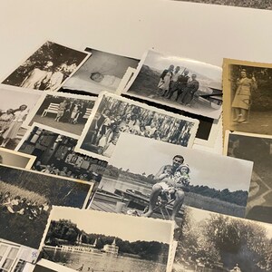 May include: A collection of black and white photographs, some featuring people, some landscapes, and some buildings. The photos are arranged in a random order and are all of different sizes.