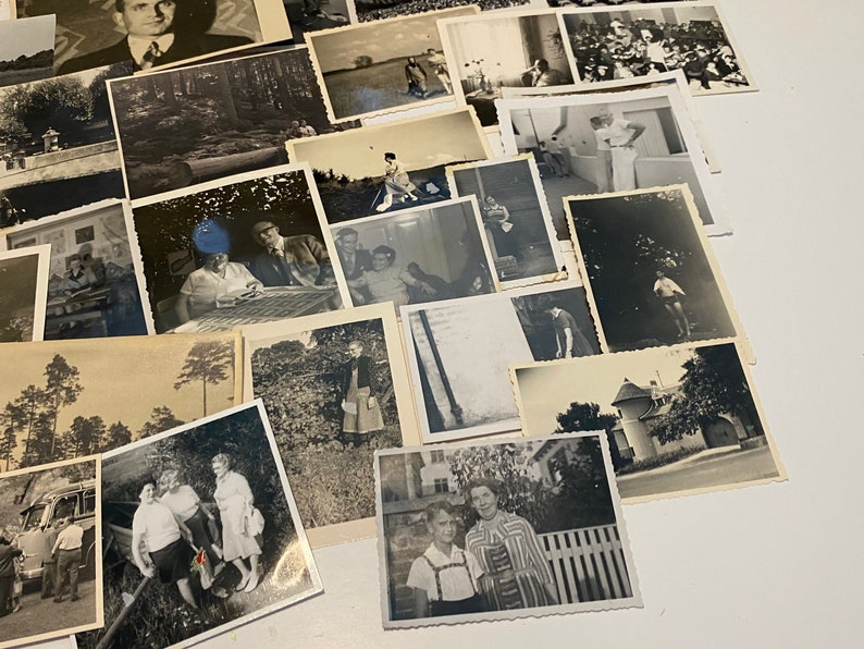 May include: A collection of vintage black and white photographs, some featuring people, some landscapes, and some buildings. The photos are arranged in a random order and are all of different sizes.