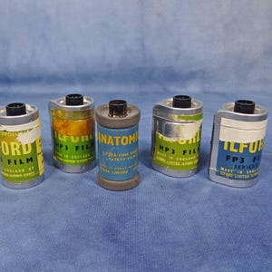 5 Vintage 35mm empty used film cassettes
