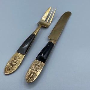 Vintage Embossed Brass Siamese Knife and Fork with Wooden Handles.
