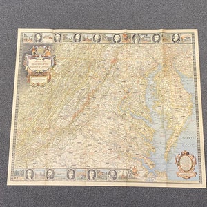 May include: An antique map of the Eastern United States, showing the area around Washington D.C. and the surrounding states. The map is printed on paper and has a vintage look. The map is framed by a border of small portraits of historical figures.
