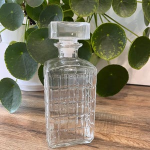 Square pressed glass whiskey bottle