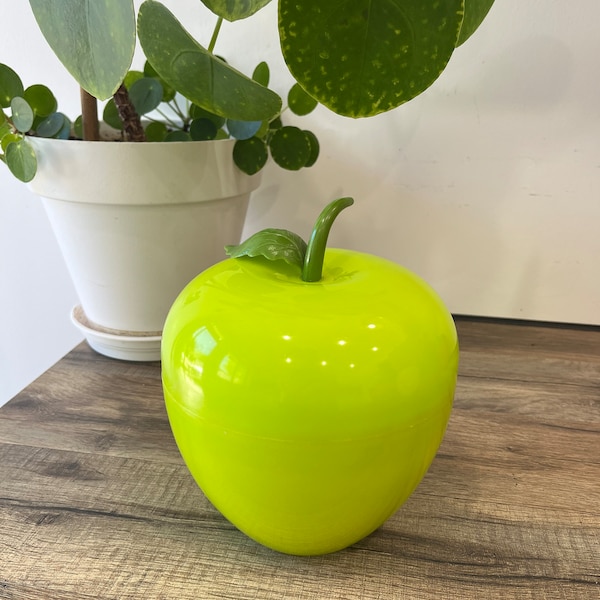 Vintage insulated ice cube bucket in the shape of an almost neon green apple with stem and leaf