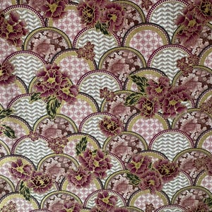 May include: A decorative fabric featuring a repeating pattern of stylized floral and geometric elements. The design includes burgundy peonies with gold accents, set against a backdrop of gray chevron and pink circular patterns.