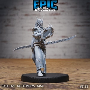 May include: Grey plastic miniature figurine of a person with long hair and a sword. The person is wearing a robe and holding a round object. The base is black and reads "BASE SIZE: MEDIUM (25.5MM)" and "#3188".