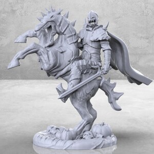 May include: A gray 3D printed miniature of a knight riding a skeletal horse. The knight is wearing armor and a cape. The horse has a skull-like head and is rearing up on its hind legs. The miniature is set on a base with skulls and bones.