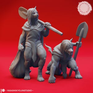 May include: Two gray painted figurines of anthropomorphic wolves, one holding a shovel and the other holding a smaller shovel. Both figures are wearing cloaks and have long hair.