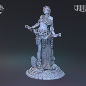 May include: A detailed 3D-printed figurine of a woman with a blindfold, holding ornate staffs. The figure is adorned with intricate details, including tattoos and layered clothing. The base is a detailed circular platform. The Print Shop 3D logo is visible.