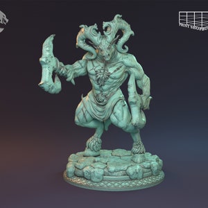 May include: A green painted miniature figurine of a horned, goat-like creature holding a large axe. The creature is standing on a circular base with a textured surface.