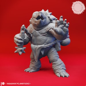 May include: A gray, detailed miniature figurine of a turtle-like creature with a spiked club in one hand and a defensive posture with the other. The figurine is set against a red background.