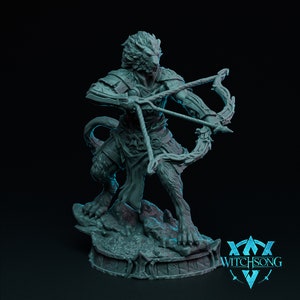 May include: A gray, detailed miniature figurine of a lion-like creature holding a bow and arrow. The figurine is standing on a base with the text "WITCHSONG" printed on it.