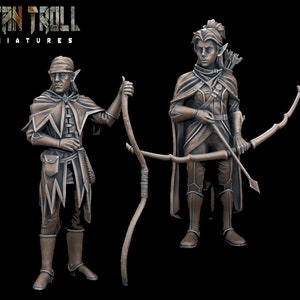May include: Two painted miniature figures of elves, one holding a bow and arrow and the other holding a staff. Both figures are wearing brown leather clothing and have pointed ears.