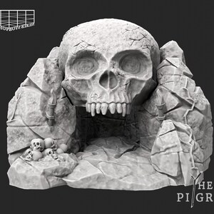 May include: A gray skull-shaped sculpture with a rocky exterior. The skull has visible cracks and a gaping mouth. Small skulls are at the base. The text "THE PILGRIM" is visible.