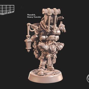 May include: A miniature figurine of a dwarf carrying a large amount of cargo, including a lantern, a chest, and a backpack. The dwarf is wearing a hat and a beard. The figurine is made of a light brown plastic and is painted in a realistic style. The figurine is standing on a round base. The text "Thondrik, Heavy Traveler" is printed on the base.