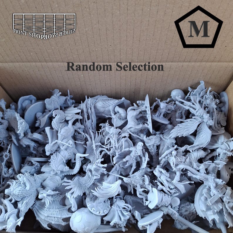 May include: A cardboard box filled with a random selection of unpainted miniature figurines. The figurines are various fantasy creatures and characters. The box has the text "Random Selection" and a logo with the letter "M".