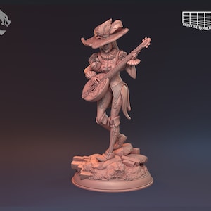 May include: A detailed miniature figurine of a female figure wearing a feathered hat and playing a lute. The figure is standing on a rocky base.