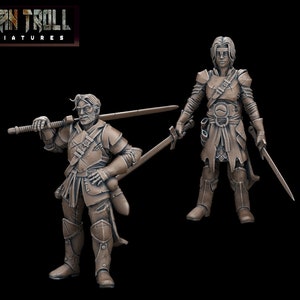 May include: Two painted miniature figures of people wearing armour and holding swords. The figures are brown and have a textured surface. The figures are standing on a black background. The text "TYTAN TROLL MINIATURES" is in the top left corner of the image.