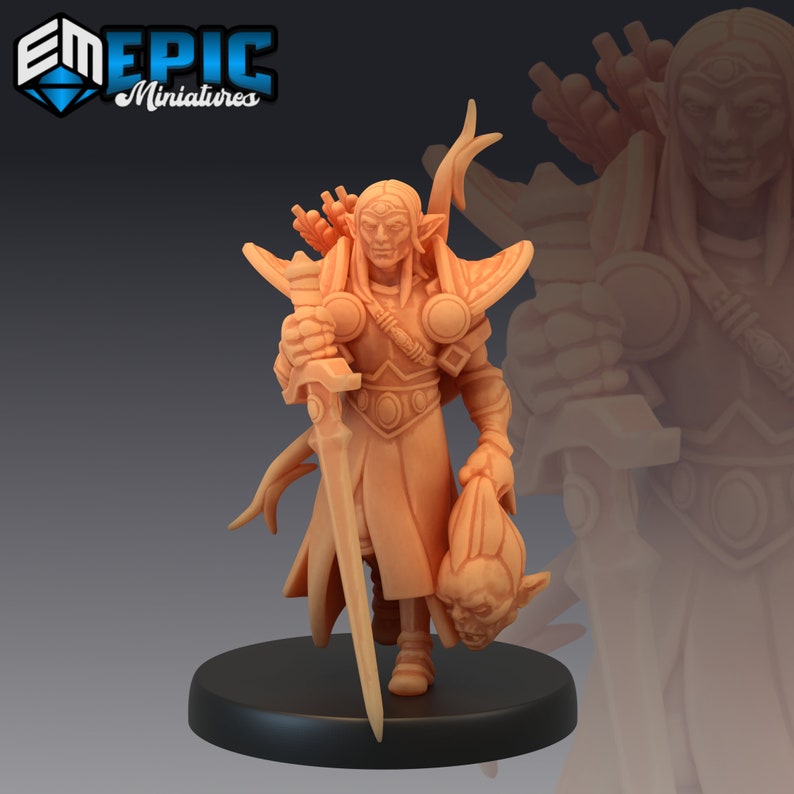 May include: A painted miniature figurine of an elf warrior holding a sword and a severed head. The elf is wearing armour and has long, flowing hair. The miniature is painted in a light brown colour.