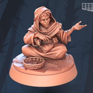 May include: A 3D printed miniature of a hooded figure with a rat sitting on their lap. The figure is wearing a robe and has a worried expression on their face. The miniature is sitting on a circular base with a decorative design.