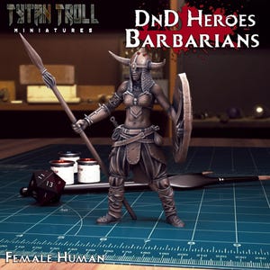 May include: A painted miniature figure of a female barbarian warrior. She is wearing a horned helmet, a leather bra, and a skirt. She is holding a spear in one hand and a shield in the other. The miniature is painted in a bronze color. The miniature is on a green mat with a ruler and dice.