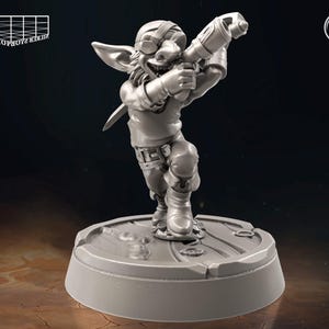 May include: A gray, detailed miniature figurine of a goblin holding a weapon and wearing a helmet and goggles. The goblin is standing on a round base.