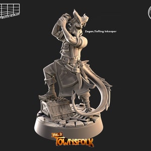 May include: A grey 3D printed miniature of a tiefling innkeeper with horns, a tail, and a beard, holding a tankard. The miniature is standing on a base with a wooden crate and a cobblestone design. The text "Zagan, Tiefling Innkeeper" is printed on the base. The miniature is part of the "Townsfolk Vol. 2" collection.