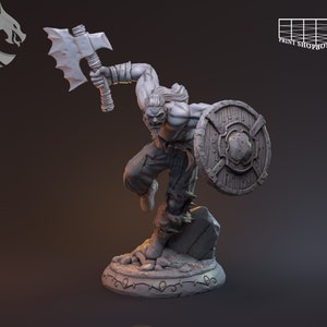 May include: A gray, detailed miniature figurine of a warrior holding a large axe and a shield. The warrior is wearing a tunic and has a beard. The figurine is standing on a rocky base.