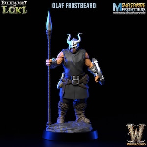 May include: A miniature figure of a warrior with a horned helmet, holding a spear and a shield. The figure is painted in a dark grey color with silver accents. The figure is standing on a black base with a blue glow around it. The figure is labeled "Olaf Frostbeard".