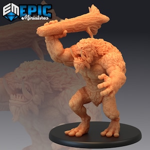 May include: A miniature figurine of a brown, furry creature with a club. The creature has a large mouth with sharp teeth and a long, bushy beard. The figurine is standing on a black base.