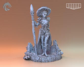 May include: A white painted miniature figurine of a female figure with a mushroom cap hat, holding a staff. The figure is standing on a base with a mushroom and tree bark design.