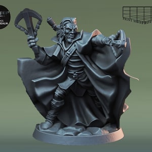 May include: A grey painted miniature figurine of a fantasy character wearing a cloak and holding a weapon. The character has a beard and a stern expression.