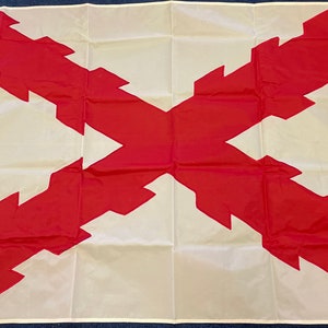 May include: A white flag with a red cross. The cross is made up of a series of jagged edges, giving it a unique and decorative look.