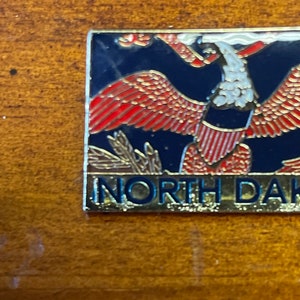 North Dakota state flag pin hand stamped and baked finished cloisonné pin