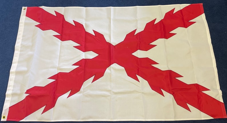 May include: A white flag with a red cross. The cross is made up of jagged lines, giving it a sharp, pointed appearance.