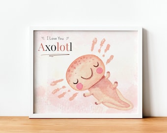 May include: A framed print featuring a watercolor illustration of a smiling axolotl. The axolotl is pink with rosy cheeks and a happy expression. The words "I Love You" and "Axolotl" are written above the axolotl.