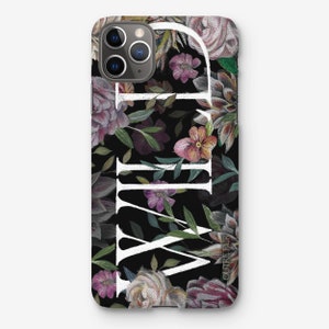 May include: A black phone case with a floral pattern and the word "WILD" in white lettering. The flowers are in shades of pink, purple, and green. The case is designed for an iPhone.