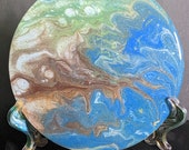 Beautiful 6.5 in acrylic on wood with deep epoxy finish. Beautiful blue green white brown with a bit of sparkle. Matching hand-painted stand