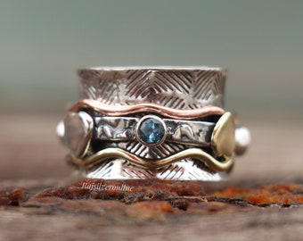 Anillo giratorio texturizado de plata de ley, topacio azul, banda ancha de metal mixto, joyería hecha a mano