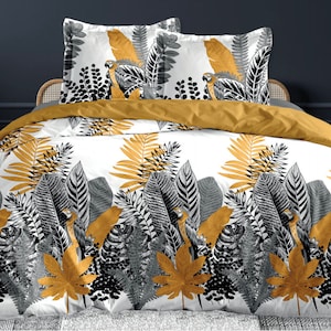 Peut inclure: Housse de couette et deux taies d'oreiller assorties à motifs de feuilles tropicales blanches et dorées. La housse de couette et les taies d'oreiller présentent une illustration en noir et blanc de perroquets et de feuilles.