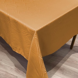 Mantel rectangular contemporáneo de damasco, 100 % poliéster, color ocre, resistente a las manchas, con patrón cinético.