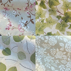 Peut inclure: Un &eacute;chantillon de tissu avec quatre motifs diff&eacute;rents. En haut &agrave; gauche, des fleurs de cerisier roses et blanches. En haut &agrave; droite, des feuilles de lierre vertes. En bas &agrave; gauche, des feuilles ray&eacute;es vertes et noires. En bas &agrave; droite, des roses blanches.