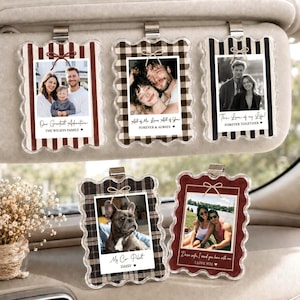 May include: Five rectangular car visor clips with scalloped edges, featuring various patterns including red stripes, buffalo plaid, and black stripes. Each clip displays a photo and text such as Our Greatest Adventure, All of Me, Forever Together, My Co-Pilot, and I Love You.