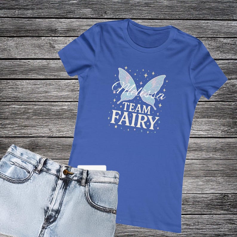 Royal blue shirt with team fairy text and name Melissa written across the wings